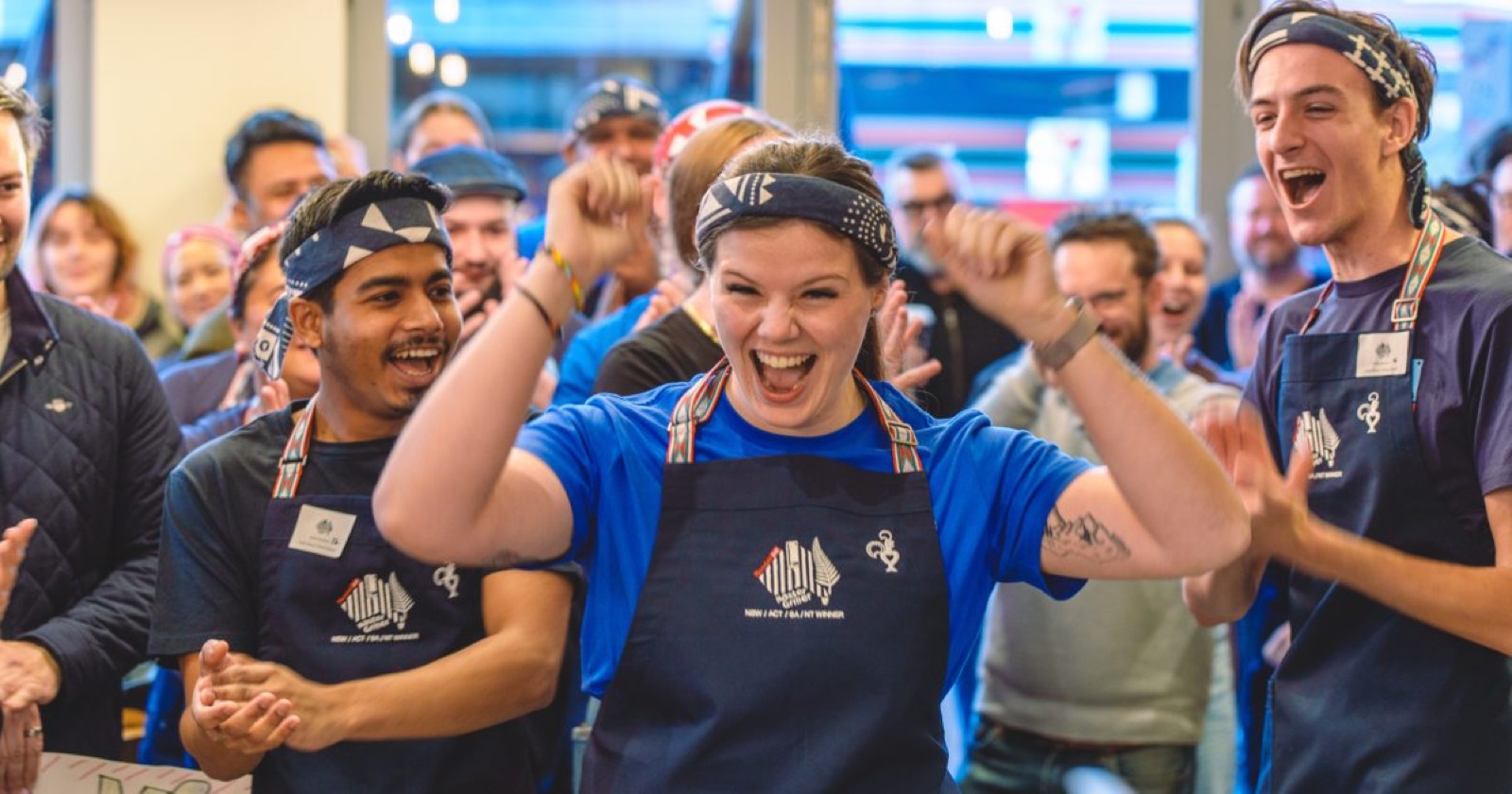 Nando’s restaurant team celebrating together in store.